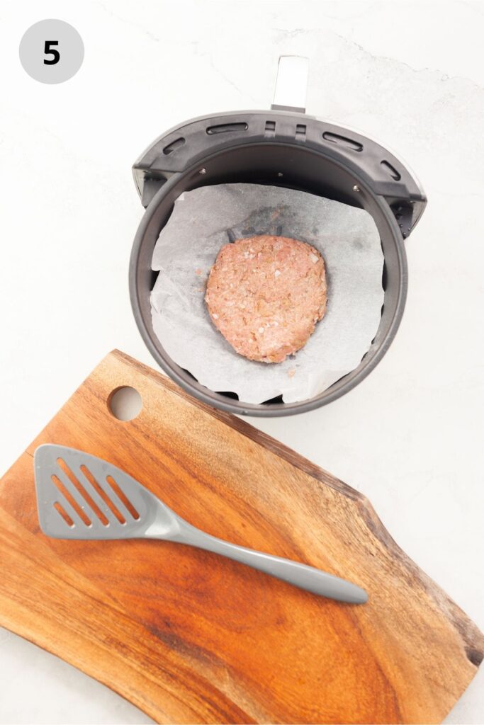 Raw turkey patty in an air fryer