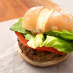Air fryer turkey burger in a bun with lettuce and tomato