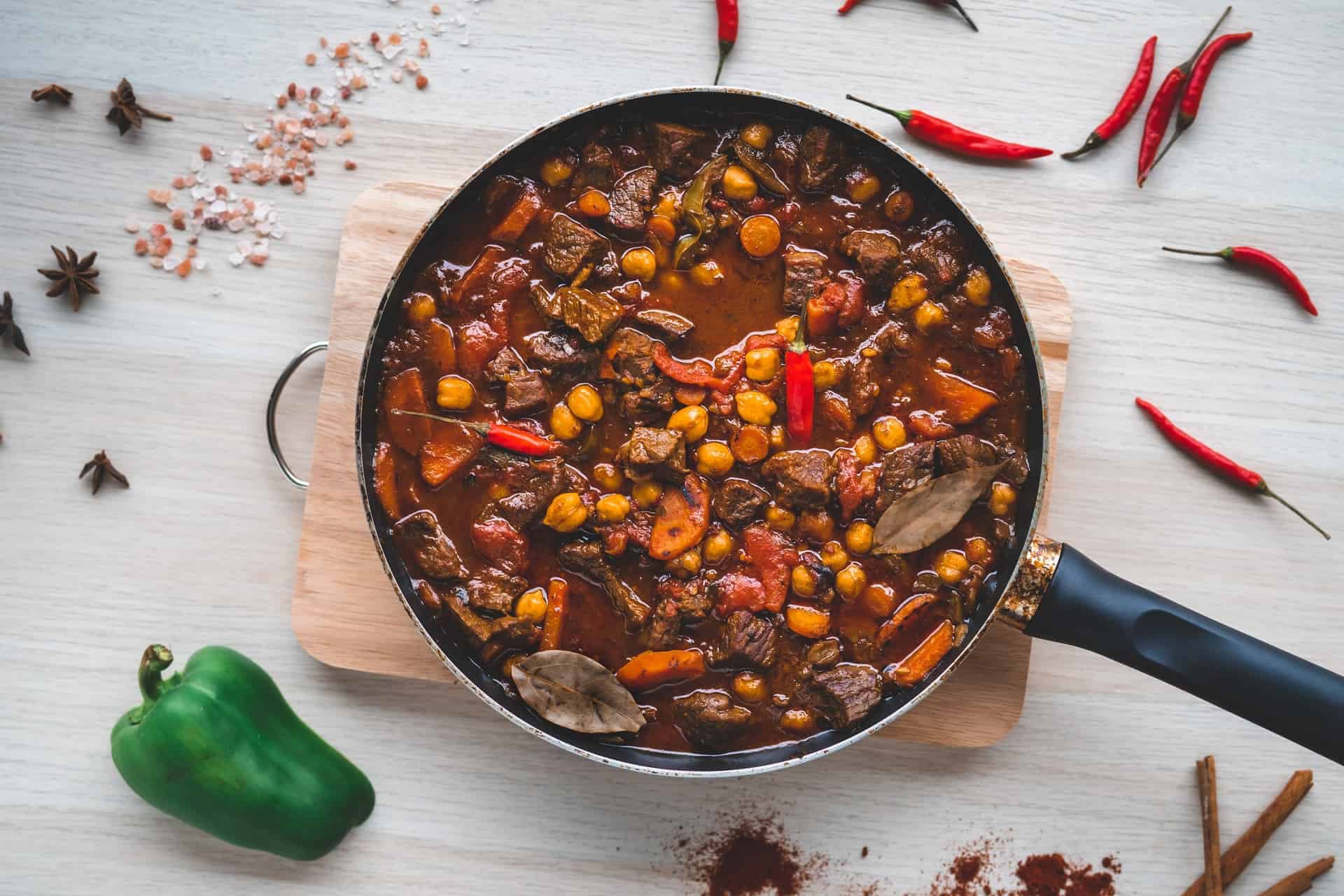Moroccan stew in a saute pan with chillies and spices