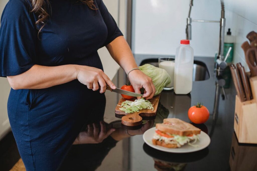 Woman chopping cabbages to put in her sandwich