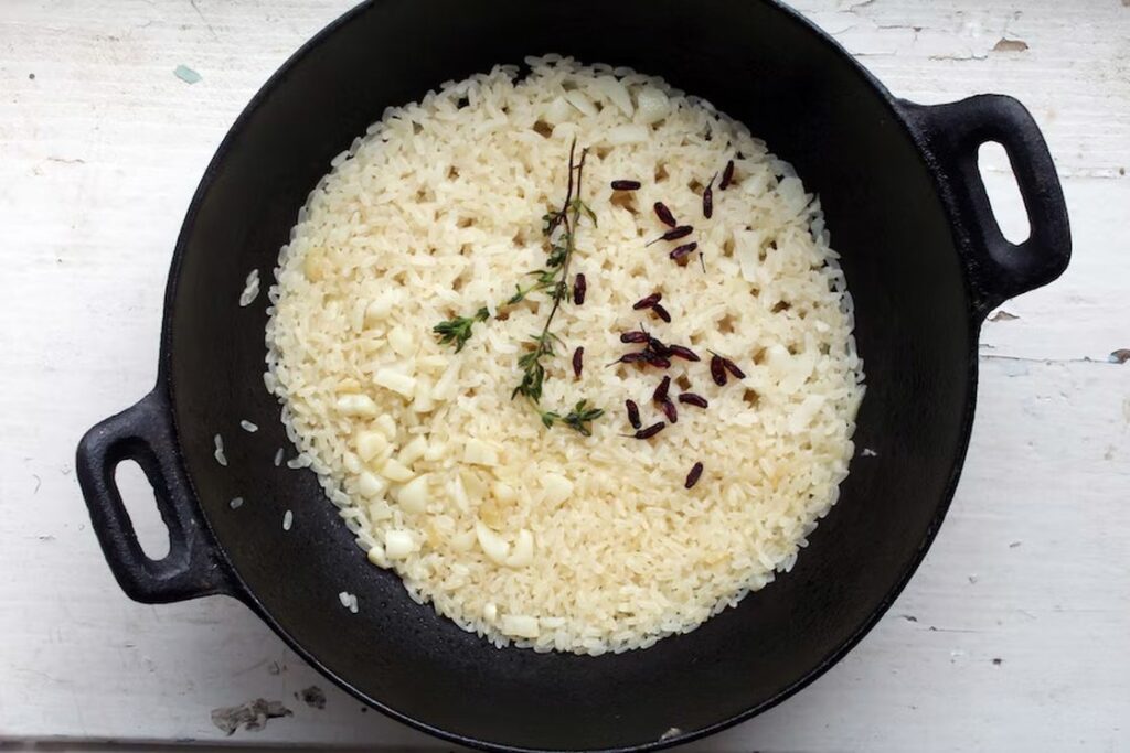 Cooked rice in a cast iron pan