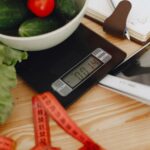 Digital scale showing the weight of the vegetables placed on top of it