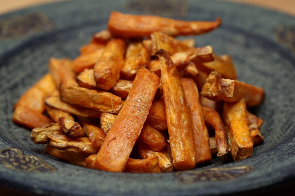 A golden brown air-fried japanese sweet potato served in a plate