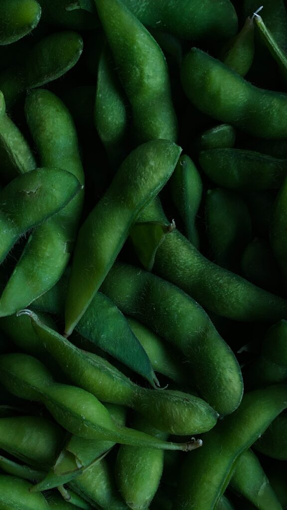 A bundle of green ademame in a container