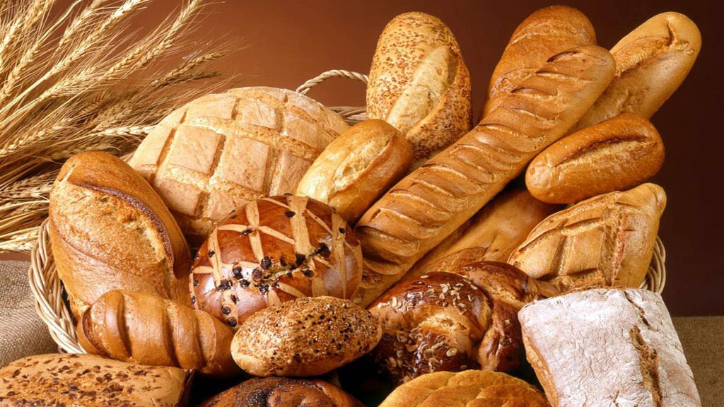 Different kinds of bread in a wooden basket