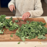 Lemony white bean and kale soup with sausage on a bowl