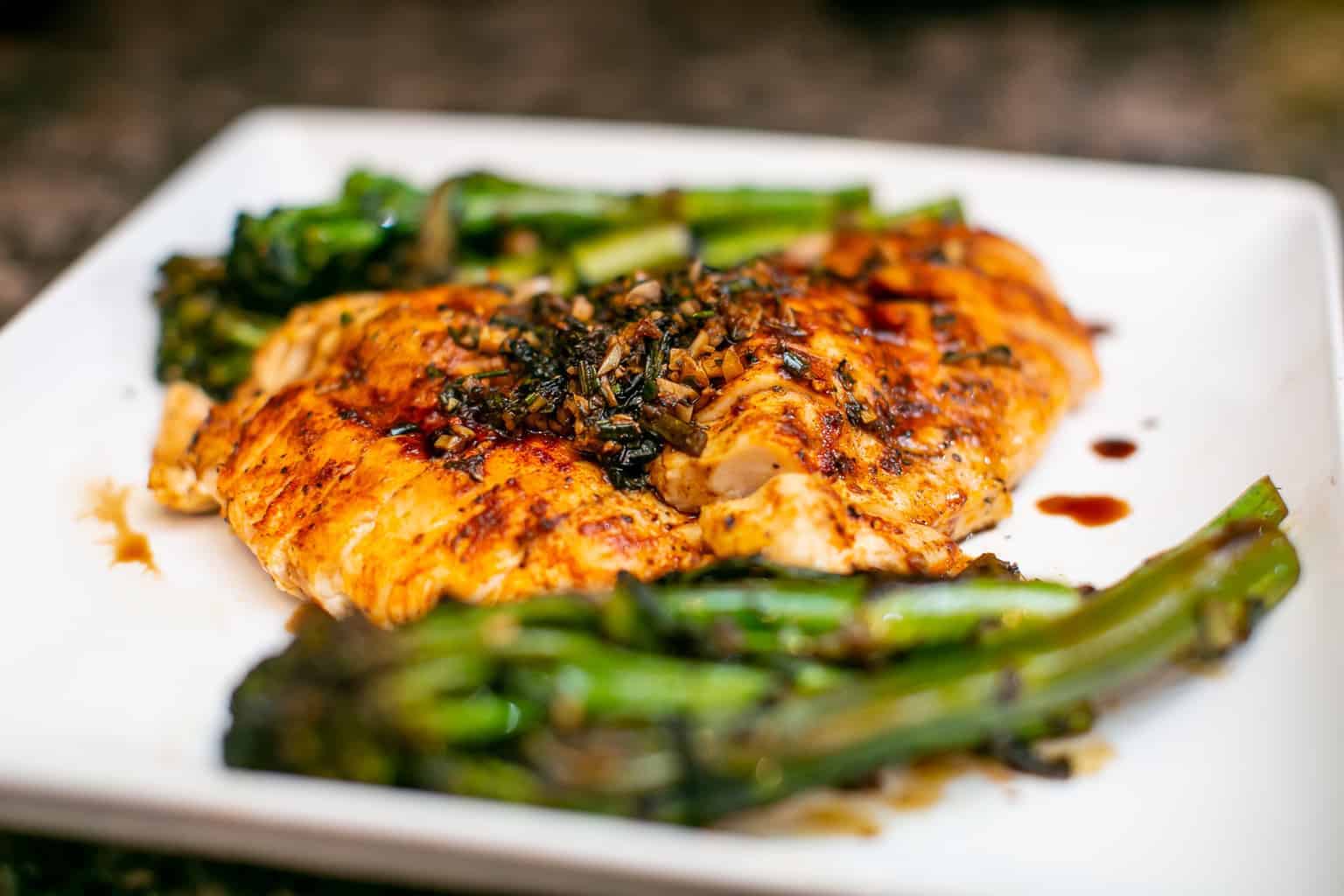 Grilled chicken breast with rosemary and garlic served with roasted asparagus