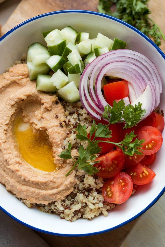 Mediterranean Breakfast Bowl with Quinoa, Hummus, and Veggies