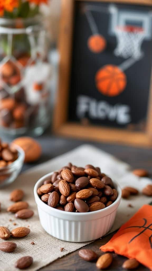 A bowl of dark chocolate covered almonds surrounded by basketballs.