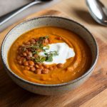 A bowl of pumpkin and red lentil soup