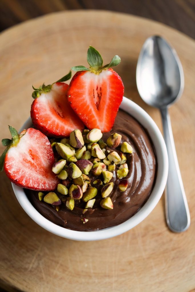 Dark Chocolate Pudding With Pistachios and Strawberries
