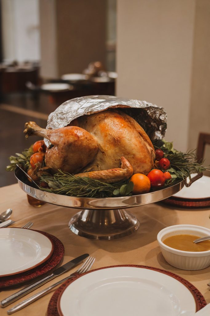 A turkey placed on a warm platter