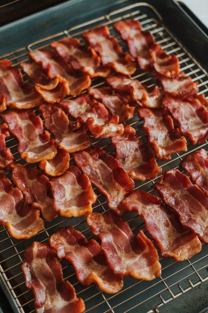 Thick small pieces of bacon strips on a cooling rack