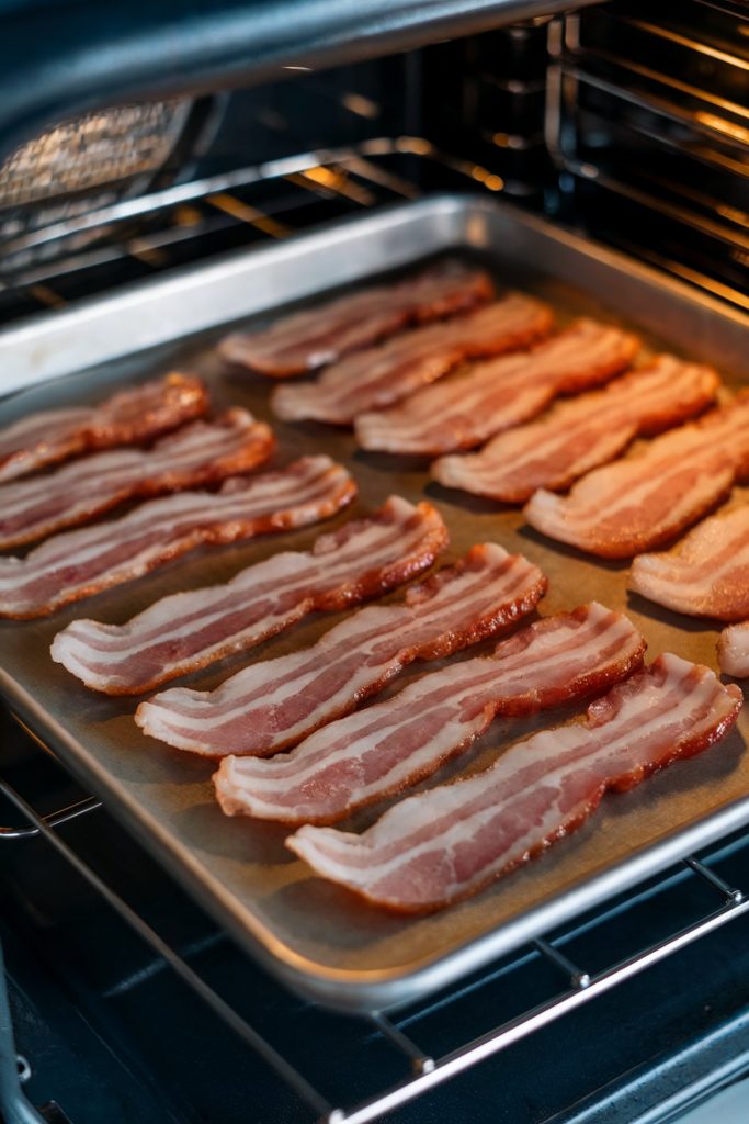 Raw bacon strips on a tray
