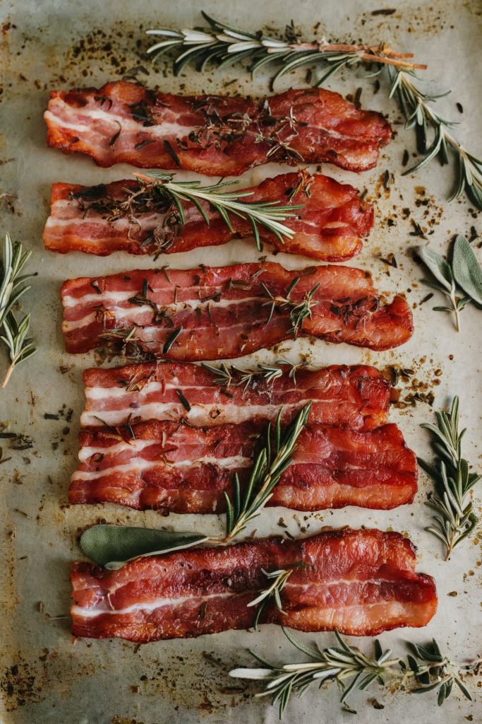 Baked bacon topped with herbs