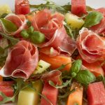 A prosciutto and melon salad with a light vinaigrette
