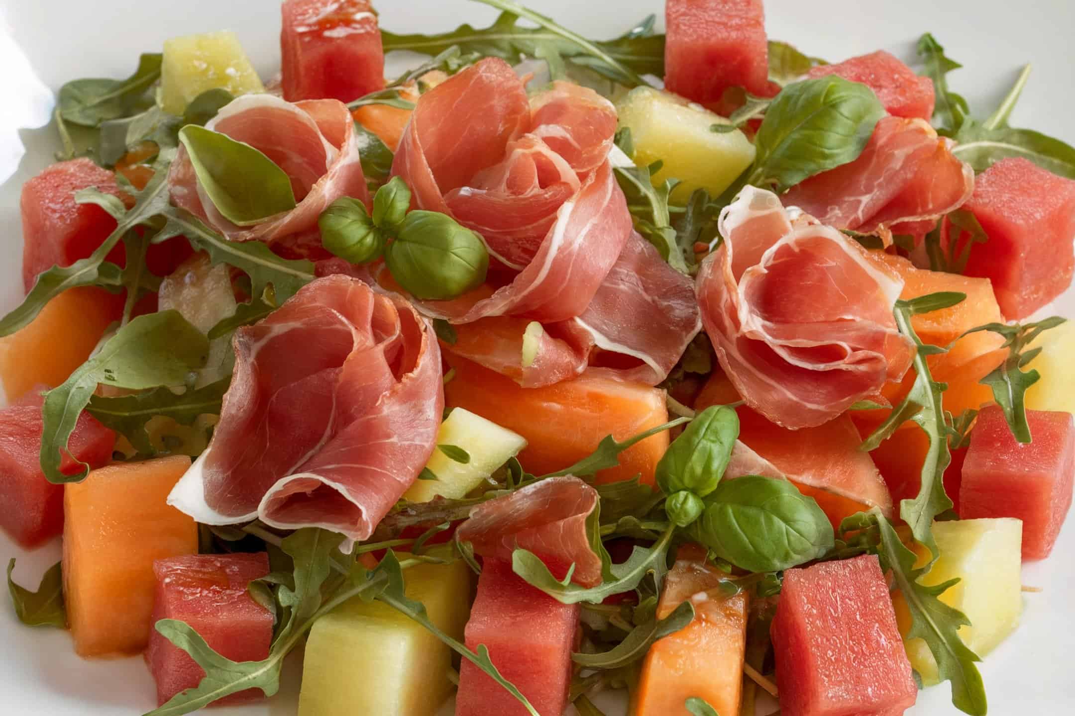 A prosciutto and melon salad with a light vinaigrette