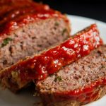 A meatloaf, sliced into two portions