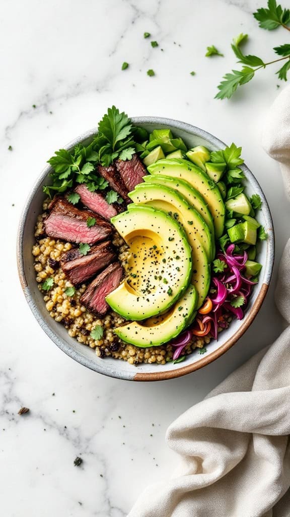 A delicious steak and quinoa bowl topped with avocado slices, fresh herbs, and colorful vegetables.