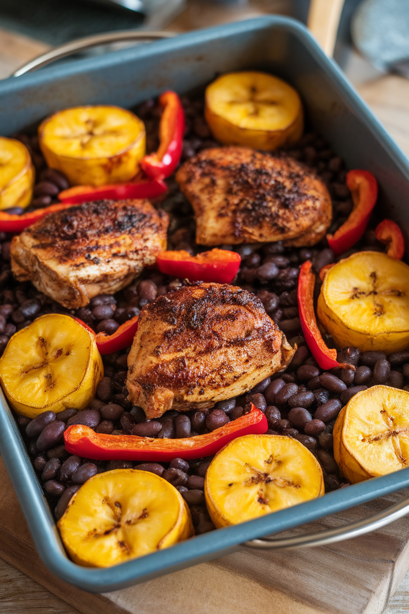 Indoor scene with a baking pan filled with sliced ripe plantains, jerk-seasoned chicken pieces, black beans, and red bell pepper strips, baked to golden perfection. No text or logos.